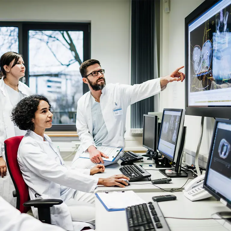 Doctors looking at brain scans