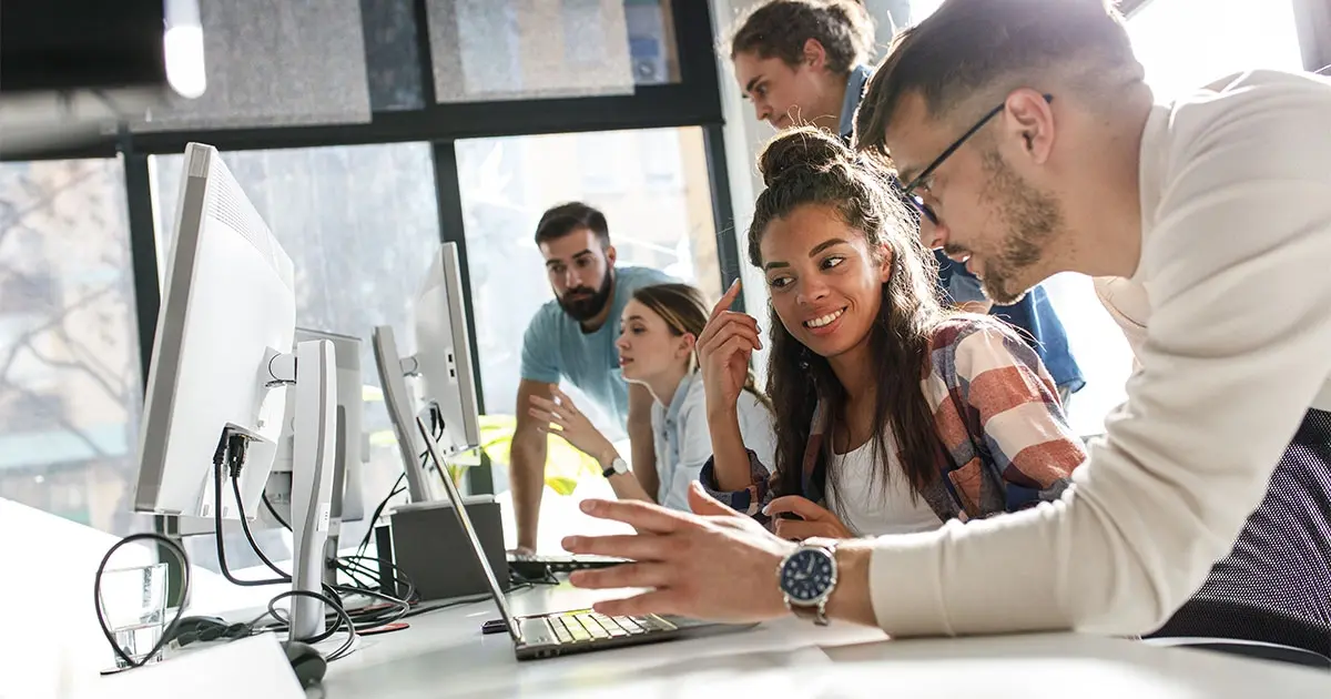 people working on a laptop together