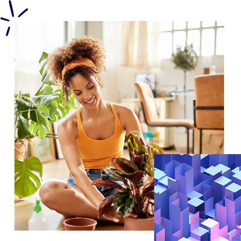 Woman sitting and tending to a plant